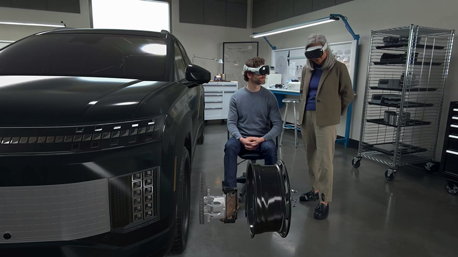 Two people at Dassault Systèmes utilizing Apple Vision Pro's shared VR experience features